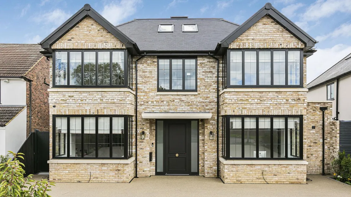 Well-kept stone-faced family home with a slate roof
